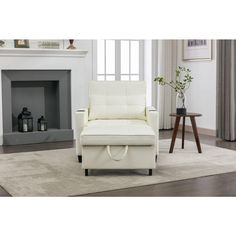 a white chair sitting on top of a rug next to a fire place in a living room