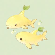 two yellow fish with green leaves on their tails