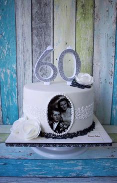 a white cake with an image of a man and woman on it