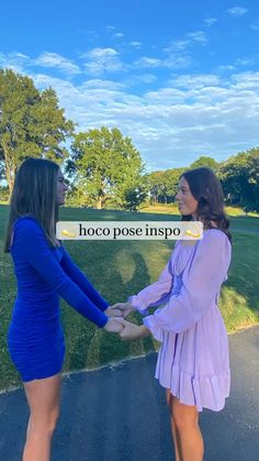 two women in blue dresses holding hands with the words hoco pose inspo