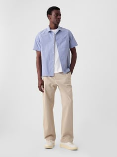 Stretch cotton khaki pants in a baggy fit.  Zip fly.  Classic five-pocket styling.  This pair of khakis is part of our water-saving Washwell program.  Compared to conventional wash methods, Washwell has saved millions of liters of water since 2016.  This product was made in a factory that runs the Gap Inc.  P. A. C. E.  Personal Advancement & Career Enhancement) program.  P. A. C. E.  is our educational program that helps the women who make our clothes build the skills, knowledge, confidence & resilience needed to advance in work & life.  Learn more at gap. com/pace Mid Rise.  Relaxed through the hip and thigh.  Loose straight leg.  Longer inseam puddles at the hem.  Models are 6'1"/185cm–6'2"/188cm with a 31"/79cm waist and 32"/81cm–33"/84cm inseam, and are wearing Gap Men Loose Pants Outfit, Gap Relaxed Fit Pants With Five Pockets, Gap Relaxed Fit Cargo Pants With Pockets, Gap Cotton Cargo Pants, Gap Cotton Cargo Pants With Pockets, Gap Casual Bottoms With Patch Pockets, Cotton Cargo Pants By Gap, Casual Gap Bottoms With Patch Pockets, Casual Gap Pants With Five Pockets