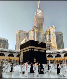 many people are around the kabab in front of some tall buildings