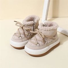 Upper Material: Leather Lining Material: Plush Heel Type: Flat with Season: Winter Closure Type: ZIP Boot Height: ANKLE Boot Type: Snow Boots Item Type: Boots Gender: baby unisex Fashion Element: Cross-tied Department Name: Baby Toe Shape: round toe