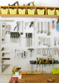 the garage organization tips are organized on pegboard