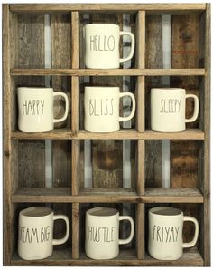 six white coffee mugs with the words hello, happy, bliss and sleepy on them