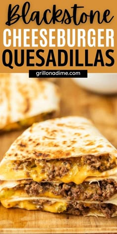 a cheeseburger quesadilla is cut in half on a cutting board