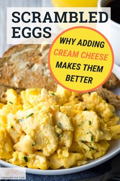 scrambled eggs on a white plate with bread and coffee in the background, text reads scrambled eggs why adding cream cheese makes them better