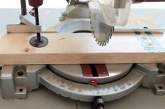 a close up of a circular sawing machine