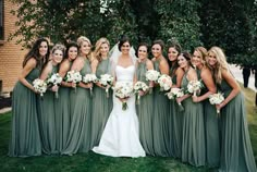 a bride and her bridal party posing for a photo