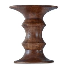 a wooden vase sitting on top of a table