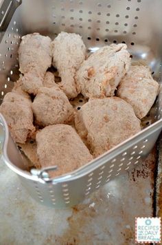 a metal basket filled with cookies on top of a counter