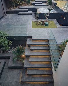 an outdoor area with stairs and water features