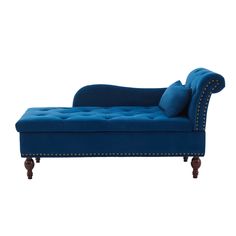 a blue chaise lounge with studded legs