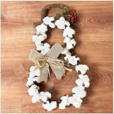 a wreath made out of cotton and twine