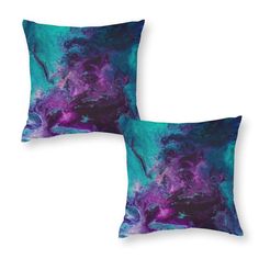 two purple and blue pillows on a white background