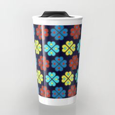 a cup with colorful flowers on it