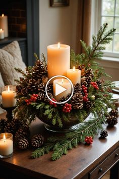 a table topped with candles and pine cones on top of a wooden table next to a window