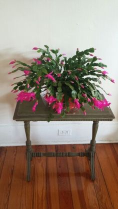 a small table with pink flowers on it