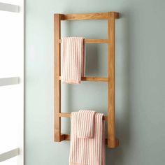 a towel rack with two towels hanging on it