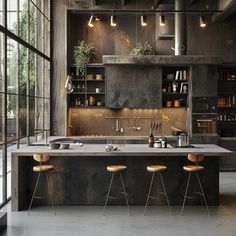 an industrial style kitchen with black cabinets and wooden stools in front of the island