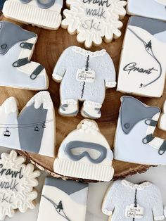 decorated cookies in the shape of sweaters and ski gear