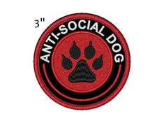 an embroidered patch with the words antisocial dog and a paw print on it