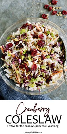 cranberry coleslaw in a glass bowl on top of a blue towel