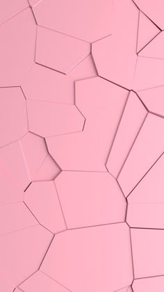 an abstract pink background with small pieces of paper in the shape of hexagonal shapes