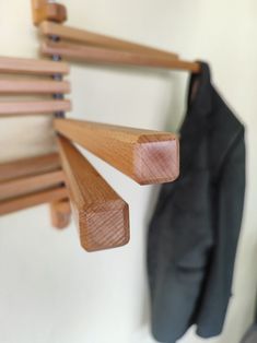 the coat rack is made out of wood