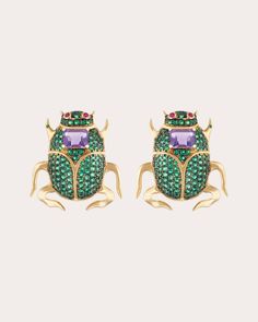 Based in solid 18-karat gold, these beetle-inspired studs are decorated with emerald-cut amethysts, pavé-set green spinels and round-cut ruby eyes. Signature emerald dots create colorful detail. From Nelly Rojas' Royal Bugs Collection. Butterfly post-back closure Signature emerald dot 18k yellow gold, emerald (dot), ruby, green spinel and amethyst Carat: 1.88 ctw Polish with soft cloth Made in Hong Kong Measurements Width: 0.74in Length: 0.78in Bugs Collection, Bug Collection, Multi Stone, Emerald Cut, Round Cut, Hong Kong, Insects, Cufflinks, Butterflies