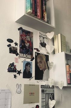 the wall is covered with pictures and magnets