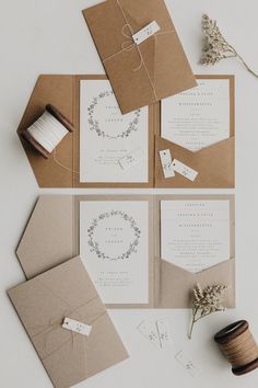 the wedding stationery is laid out and ready to be put into their guests'envelopes