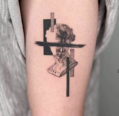 a woman with a cross tattoo on her arm