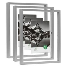 three wooden frames with black and white photos