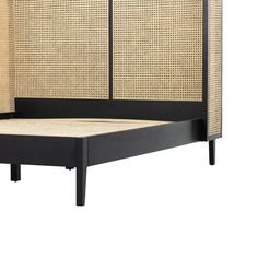 a black bed with wicker headboard and foot board on the bottom side, against a white background