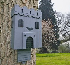 a bat house on the side of a tree