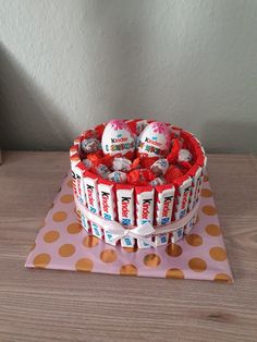 a cake decorated with candy and candies on a table