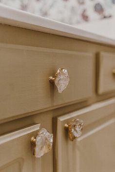 a close up of a drawer with some knobs on it