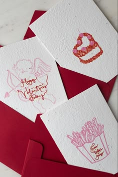 three cards with handwritten birthday messages on them, one is red and the other is white