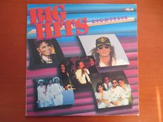 the album cover for big hits, featuring photos of people in white outfits and hats