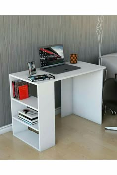 a white desk with a laptop on it