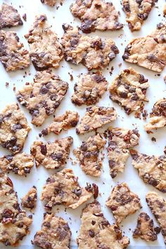 chocolate chip cookies on a baking sheet ready to be cut into bite size pieces and put in the oven