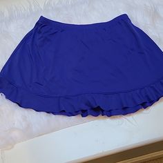 Cute Swim Skirt, Brand New Size 12, Ruffle Hem With Under Pants Attached, Color Is Not Blue Or Purple More Like A Deep Periwinkle Blue Blue Stretch Swim Skirt With Elastic Waistband, Stretch Blue Swim Skirt With Elastic Waistband, Blue Skort With Elastic Waistband, Blue Stretch Swim Skirt For Spring, Stretch Blue Swim Skirt For Spring, Blue Mini Swim Skirt For Spring, Blue Stretch Skirted Bottoms, Casual Blue Swim Skirt For Spring, Blue Skirted Swim Skirt With Lining