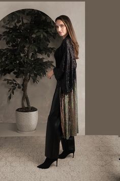 Dress to impress with our Sequin Kimono Duster. This kimono shimmers with black sequins at the top, cascading into a vibrant multicolor design. This long, flowy piece adds instant glamor to any outfit, perfect over dresses, slacks, or anything you want to elevate. Material: 50% PET Sequins, 46% Polyester, 4% Spandex Length: 125 cm Shoulder Width: 60 cm Sleeve Length: 31 cm Model: 5' 9.5" Sequin Kimono Outfit, Sequin Kimono, Kimono Outfit, Kimono Duster, Black Sequins, Dress To Impress, Sequin, The Top, Sleeve Length