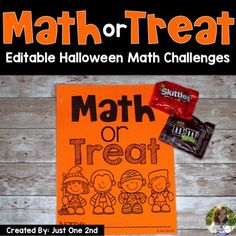 an orange sign that says math or treat with some candy on it and other items around it