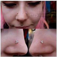 a woman with pink hair and piercings on her nose