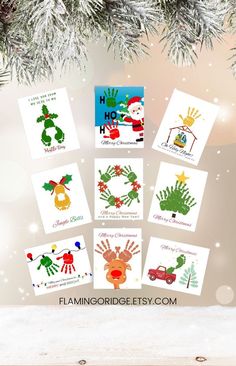 christmas cards with handprints on them hanging from a tree