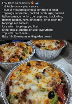 three pizzas sitting in tin foil on top of a table with instructions for how to make them