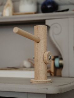 a wooden spigot sitting on top of a kitchen counter