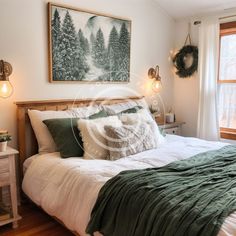 a bedroom with a bed, nightstands and pictures on the wall